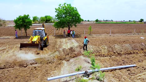 heavy-duty-excavation-machine-working-at-Indian-agricultural-land,-Earthmoving-machine-working