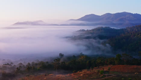 Stunning-Drone-Shot-Flying-Above-the-Clouds-at-Sunrise-in-Pai,-Thailand