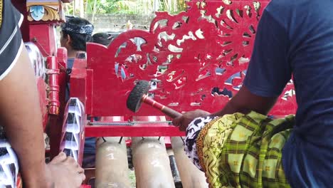 Slow-Motion-Shot-of-Gamelan-Musician-Playing-Jegog-Bamboo-Percussion-Keys-during-Daytime-in-Jembrana,-Negara,-North-Bali-Indonesia