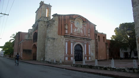 Old-Church-man-on-bicycle-passes-by