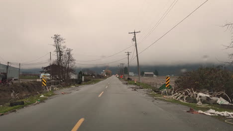 Driving-on-the-road-after-heavy-damage-from-tornadoes-in-the-Abbotsford,-BC,-Canada
