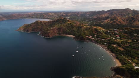 Full-panoramic-aerial-view-of-tropical-seaside-bay-in-coastline-of-Guanacaste,-Costa-Rica