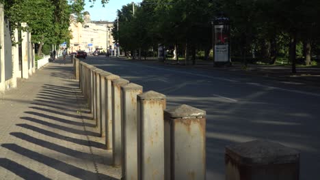 City-lifestyle-with-a-scene-of-the-auto-traffic-and-pedestrian-sidewalk-fences-for-safer-people-movement-in-urban-areas