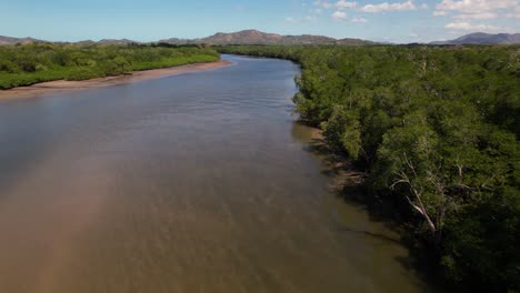 Drone-flying-over-the-tropical-estuary-with-mangroves-in-Tamarindo-Delta,-Costa-Rica