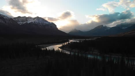 Panning-wide-aerial-drone-view-of-north-Saskatchewan-glacier-river-valley-at-dawn