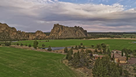 Terrebonne-Oregon-Aerial-v50-panoramic-view,-drone-flyover-luxurious-mansion-on-ranch-at-the-canyons-surrounded-by-beautiful-scenery-of-Smith-Rock-State-Park---Shot-with-Mavic-3-Cine---August-2022
