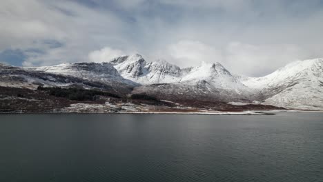Drone-dolley-shot-over-Loch-Slapin-of-the-high-Bla-Bheinn-in-winter-time-in-Scotland