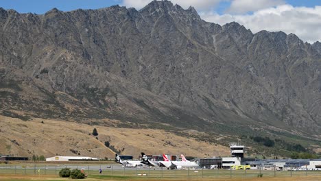 Rugged-mountains-towering-above-Queenstown-airport,-New-Zealand