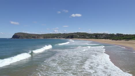 Foamy-Waves-Splashing-Onto-The-Shores-Of-MacMasters-Beach-On-The-Central-Coast,-New-South-Wales,-Australia