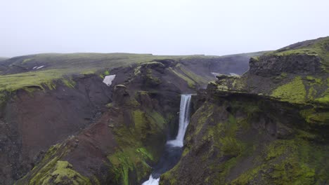 Aerial-away-from-the-famous-natural-landmark-and-tourist-attraction-of-Skogafoss-falls-and-Fimmvorduhals-trail-in-Iceland
