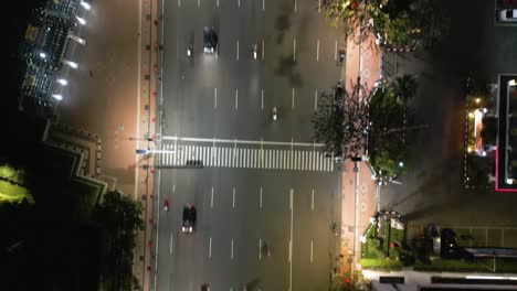 Drone-top-view-of-Pahlawan-street-at-night-in-Surabaya,-East-Java,-Indonesia