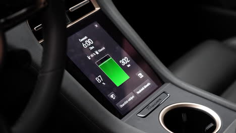 Porsche-Taycan-Charging-Console-and-State-of-Charge-Display-Inside-Car,-Close-Up