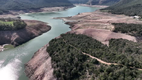 Water-reservoir-in-Sau-Catalonia-at-extreme-drought-conditions,-aerial-view