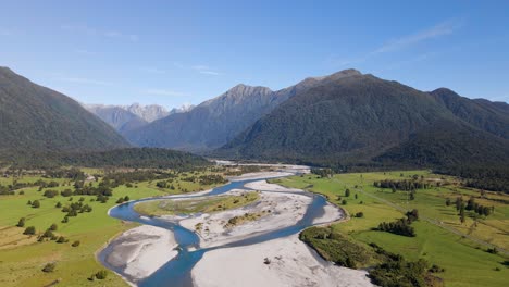 Braided-meltwater-river-coming-from-mountains-covered-with-temperate-rainforest