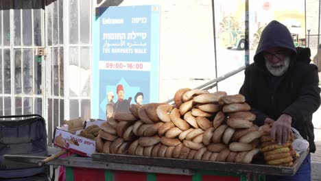Old-aged-bread-seller-in-the-street-Via-Dolorosa-of-the-old-city-of-Jerusalem