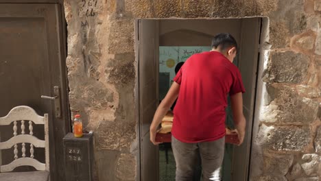 Close-up-shot-of-a-tray-of-pita-bread-taken-inside-a-small-restaurant-or-hotel-in-the-streets-of-Jerusalem