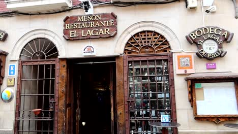 Medium-shot-on-entrance-of-old-Spanish-restaurant-and-wine-cellar