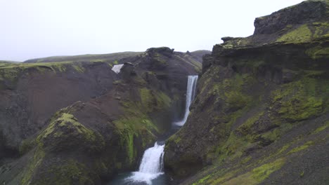 Aerial-towards-the-famous-natural-landmark-and-tourist-attraction-of-Skogafoss-falls-and-Fimmvorduhals-trail-in-Iceland