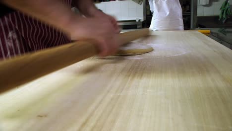 Fresh-pasta-making.-Rolling-pin-flattened-pasta-dough