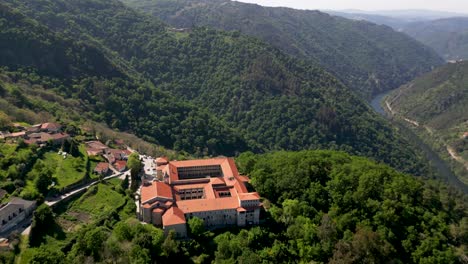 drone-shot-monastery-santo-estevo-of-ribas-of-sil,-ribeira-sacra,-nogueira-of-ramuín,-ourense,-galicia,-spain