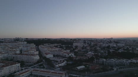 aerial-view-of-Lisbon's-skyline-from-Cascais,-Portugal-during-sunrise