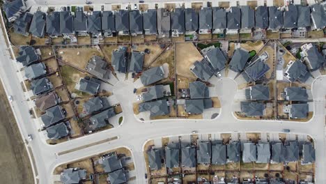 Aerial-view-of-a-modern-suburban-community-in-Calgary,-Canada,-in-spring-after-the-snow-melt