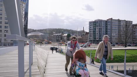 Family-walking-on-the-Passerelle-La-Belle-Liégeoise