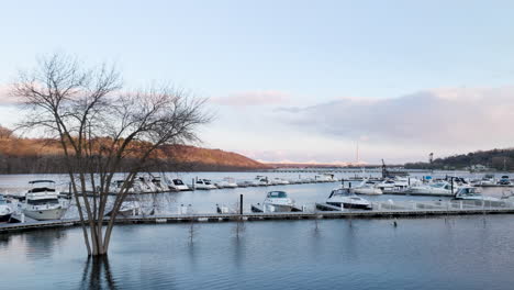Winterized-marina-flooded-with-boats-and-yachts-moored-at-docks-along-St