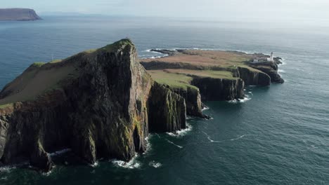 Drone-panning-shot-of-Neist-Point-at-Isle-of-Skye-in-Scotland-on-a-sunny-day