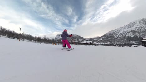Action-shot-of-young-child-downhill-skiing-in-Myrkdalen-Norway