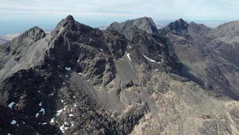 Drone-panning-shot-of-the-high-Sgurr-Alasdair-at-Isle-of-Skye-in-Scotland