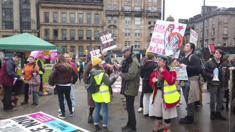 Wide-shot-of-protesters-talking-and-dancing-at-an-anti-racism-rally-in-Glasgow