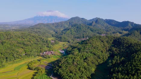 Aerial-view-of-Indonesian-countryside-landscape,-plantation,-forest-and-hills