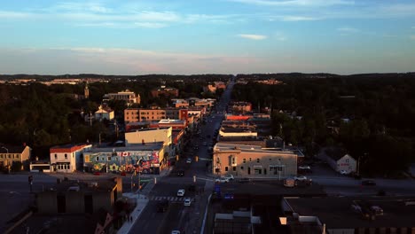 Aerial-view-of-Yonge-Street-downtown-Aurora,-Ontario,-Canada-traffic-and-buildings-at-golden-hour-in-summer