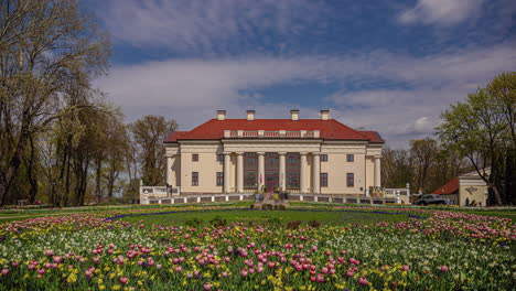 Blooming-flowers-in-front-of-Pakruojis-manor,-time-lapse-view