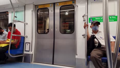 passenger-standing-at-escalator-from-metro-train-inside-view-video-is-taken-at-hauz-khas-metro-station-new-delhi-india-on-Apr-10-2022