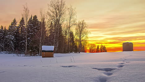 Winter-sunset-timelapse-with-cabin-and-woods