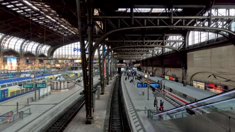 A-quiet-commute-at-the-famous-train-station-in-Hamburg,-Germany-as-a-train-is-stopped-in-the-station