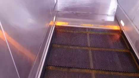 isolated-moving-escalator-going-down-from-top-angle-at-morning-video-is-taken-at-new-delhi-metro-station-new-delhi-india-on-Apr-10-2022