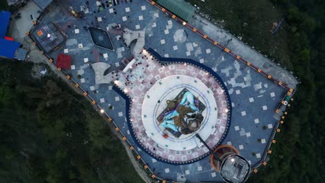 Top-down-rotating-drone-view-over-lord-shiva-statue-in-pumdikot-nepal