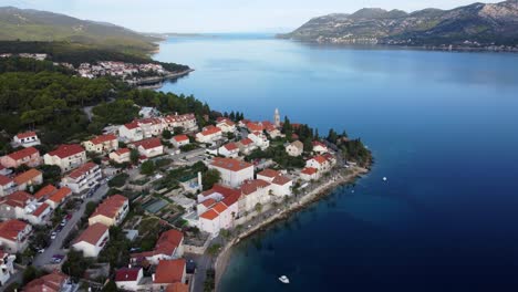 Aerial-Pullback-Revealing-Village-at-Croatian-Island-Coastline