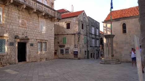 Bishop’s-Treasury-Building-Facade,-Old-Town-Croatian-Touristic-Village,-Historic-Square-and-Houses-in-Korcula