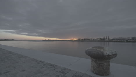 Timelapse-of-the-sunset-near-the-Schelde-river-in-Antwerp-filmed-from-the-quay-with-a-boulder-in-the-foreground-LOG