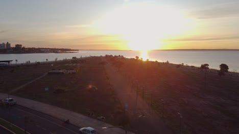 Drone-footage-over-the-road-and-walk-way-toward-the-beach-during-sunset-Posadas-Brete-Argentina
