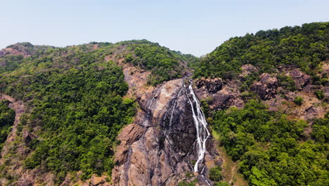 Waterfall-Cascading-Down-Rocky-Cliff-In-India---aerial-drone-shot