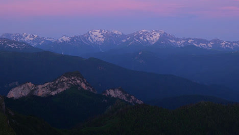 Blue-hour-purple-hue-dusk-sunset-on-caucasus-kavkaz-mountain-range-snowy-ridgeline
