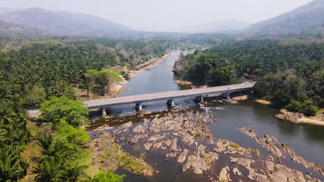 Aerial-View-Of-Vettilapara-Bridge-Across-Chalakkudy-River-In-Thrissur-District,-Kerala,-India
