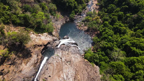 Aerial-View-Of-Dudhsagar-Falls-Surrounded-With-Lush-Vegetation-In-Goa,-India---drone-shot