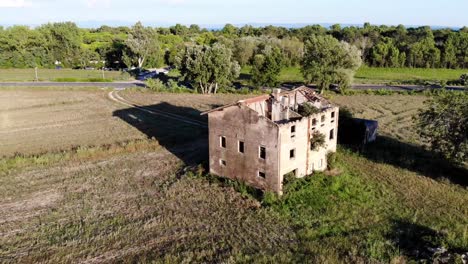 Drone-footage-of-a-abandoned-house-in-Grado,-Italy
