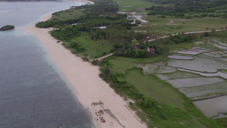 Tilt-up-shot-Pantai-Marosi-Sumba-Indonesia-nobody-at-the-beach,-aerial